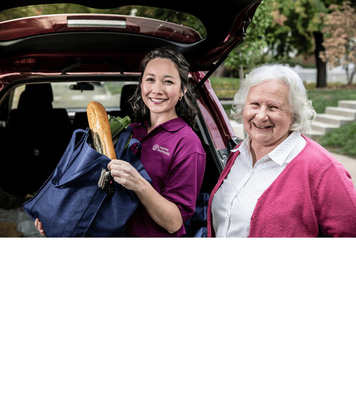 Care Pro helping senior get groceries out of a trunk