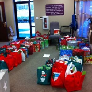 many be a santa to a senior gift bags sitting at the home instead office
