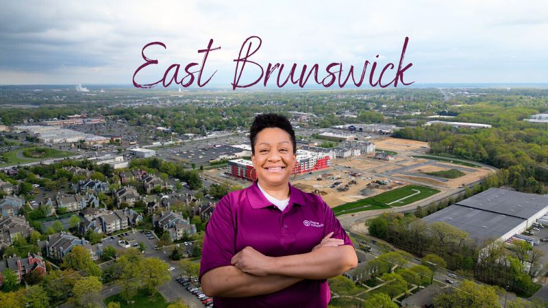 Home Instead caregiver with East Brunswick, New Jersey  in the background