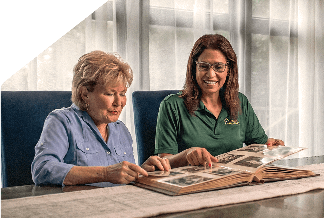 A Home Instead Care Pro with an adult.