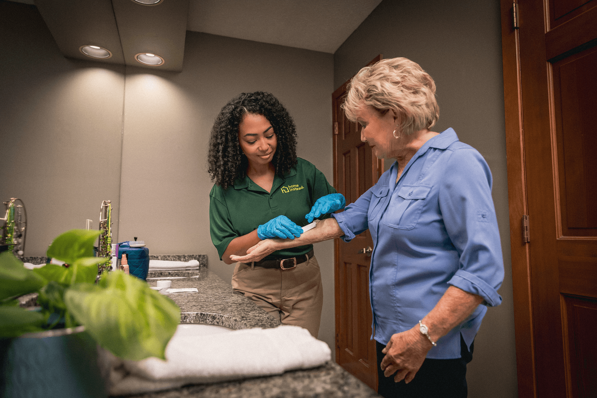 A Home Instead Care Pro with an adult.