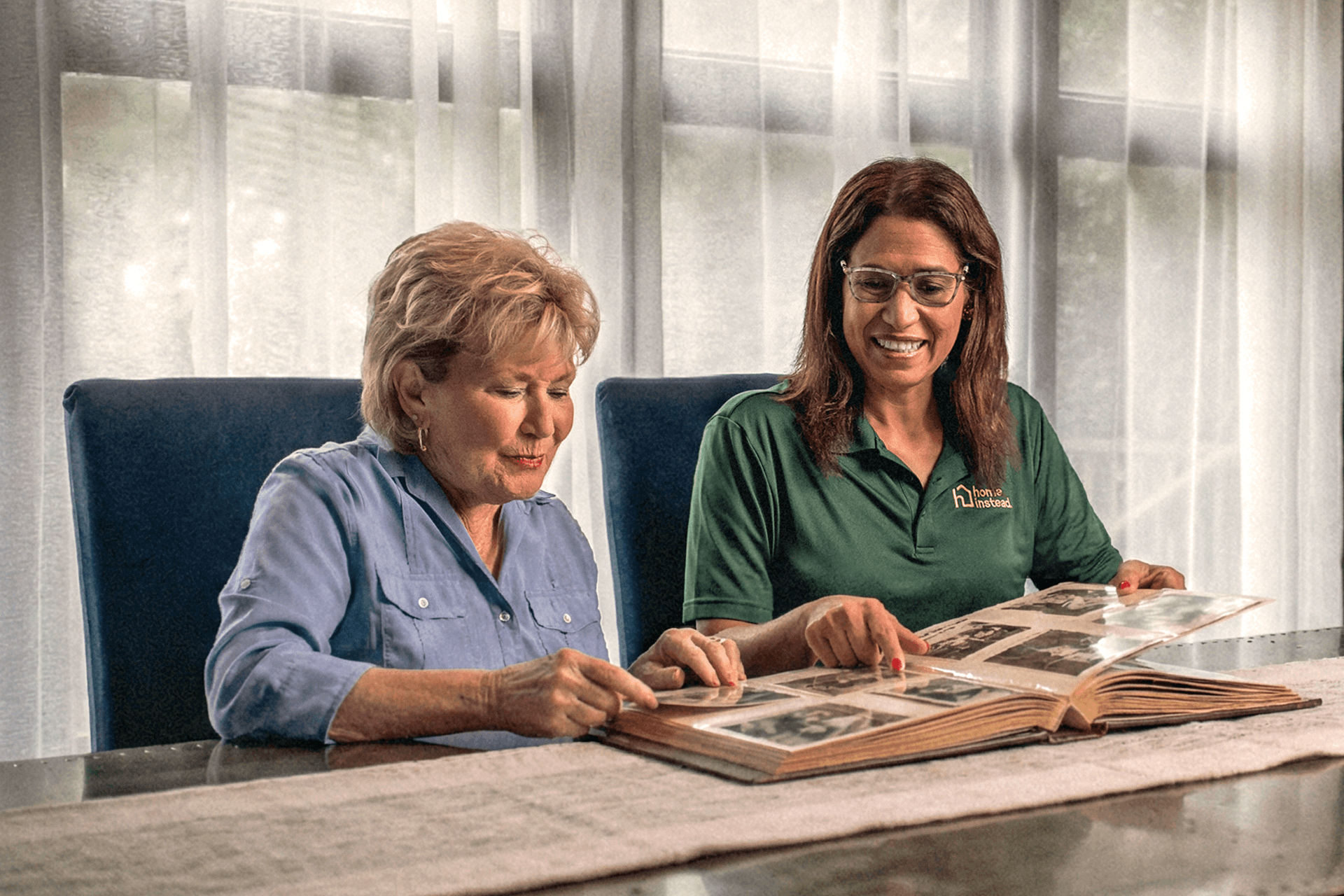 A Home Instead Care Pro with an adult.