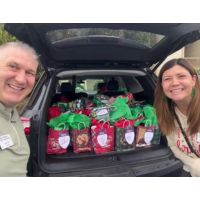 home care team with car load of gifts for seniors