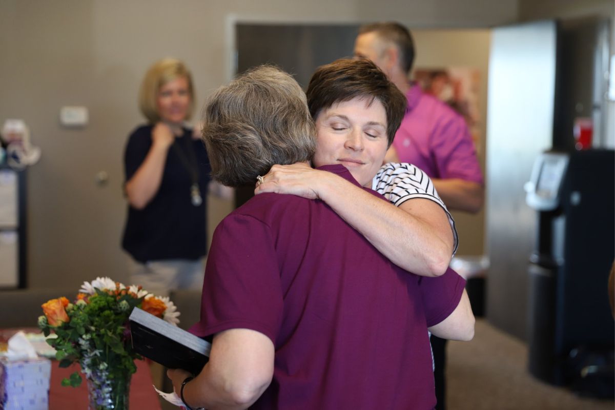 grateful family member hugging home instead of lincoln nebraska caregiver