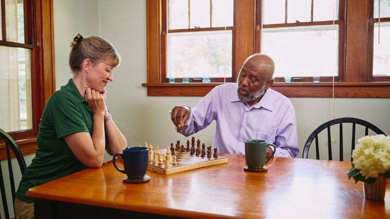 Home Instead caregiver with senior client in Palmetto, FL
