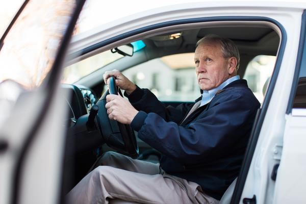 senior man in a car