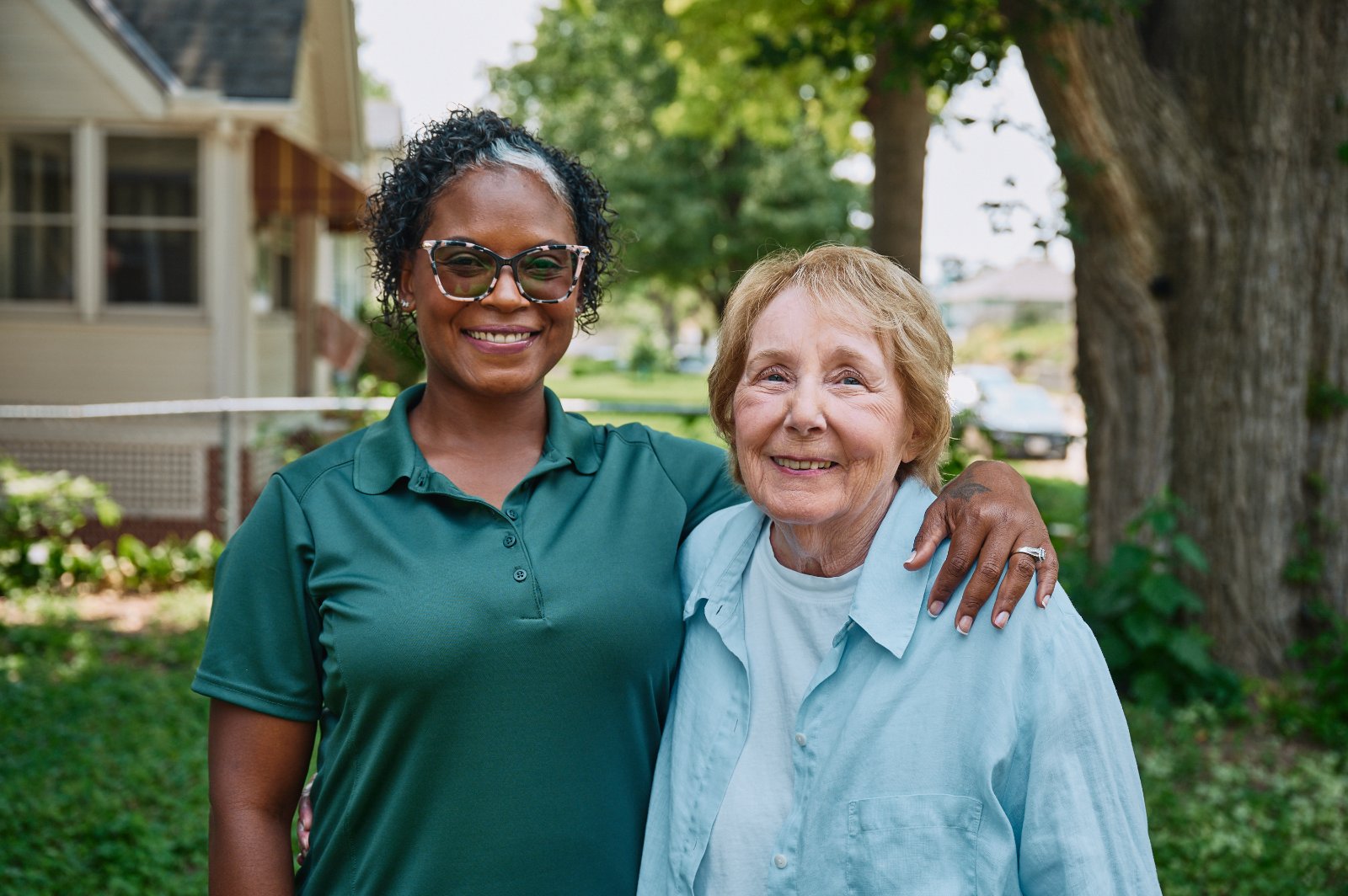 Home Instead Caregiver wearing mask brings groceries to the home of an aging adult.