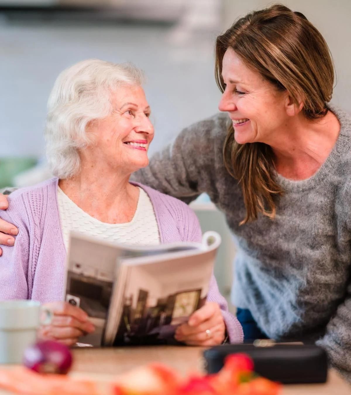 caregiver and client having a cheerful conversation