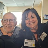home instead caregiver and client (in hospital)