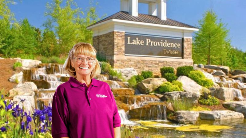 Home Instead caregiver with Del Webb Lake Providence, Mount Juliet, Tennessee in the background