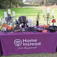 home instead booth at alzheimer's aid golf tournament