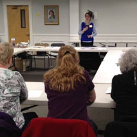 home instead caregivers sitting at training session in framingham