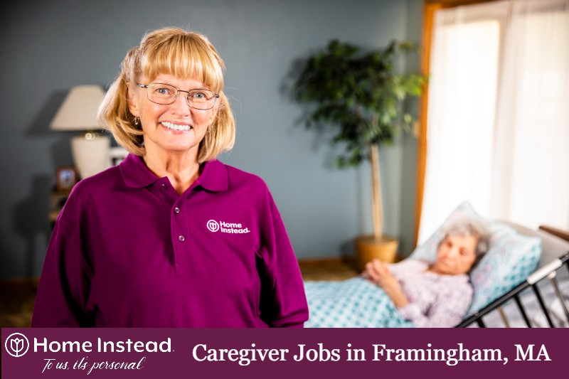 framingham, ma caregiver standing with senior in a bed in the background