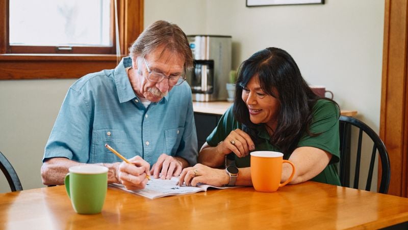 Home Instead caregiver with Crawfordsville Indiana in the background