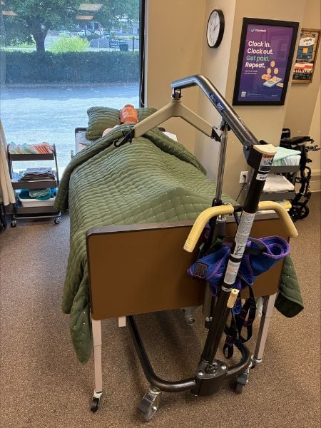 training dummy laying in bed in care pro training room