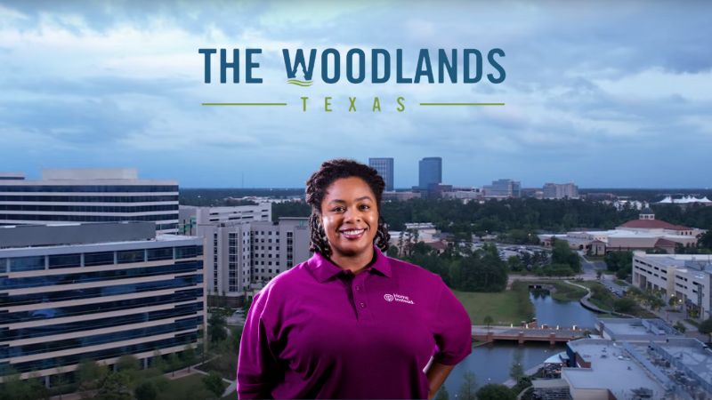 Home Instead caregiver with The Woodlands Texas in the background