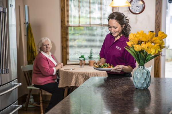 Home Instead Care Pro and Calgary Senior in the kitchen 1 