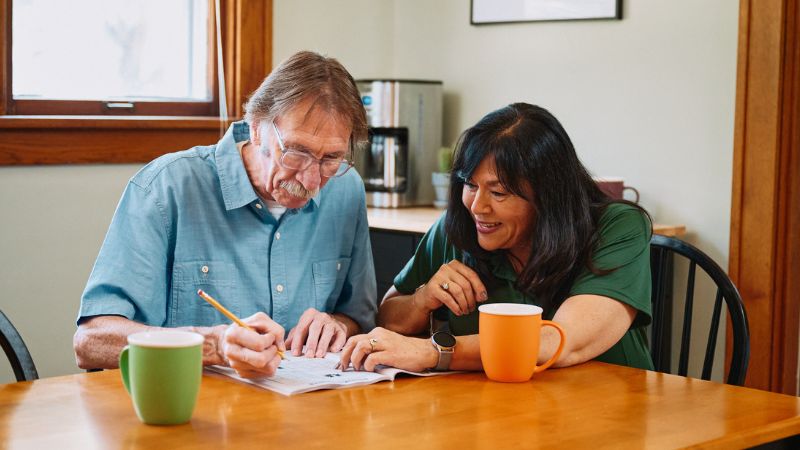 Home Instead caregiver with senior client