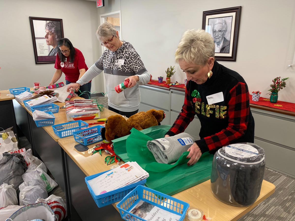 Home Instead Staff wrapping gifts for seniors