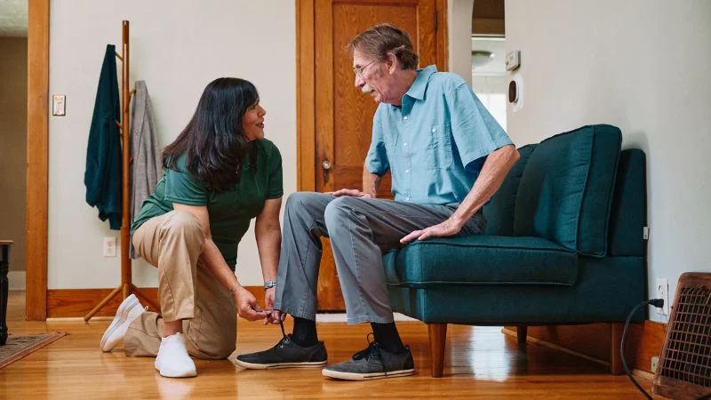Home Instead caregiver with senior client