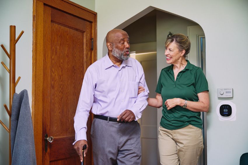 Home Instead Caregiver and senior enjoying each other sharing a laugh