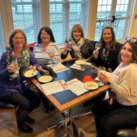 ladies having glass of wine at networking event