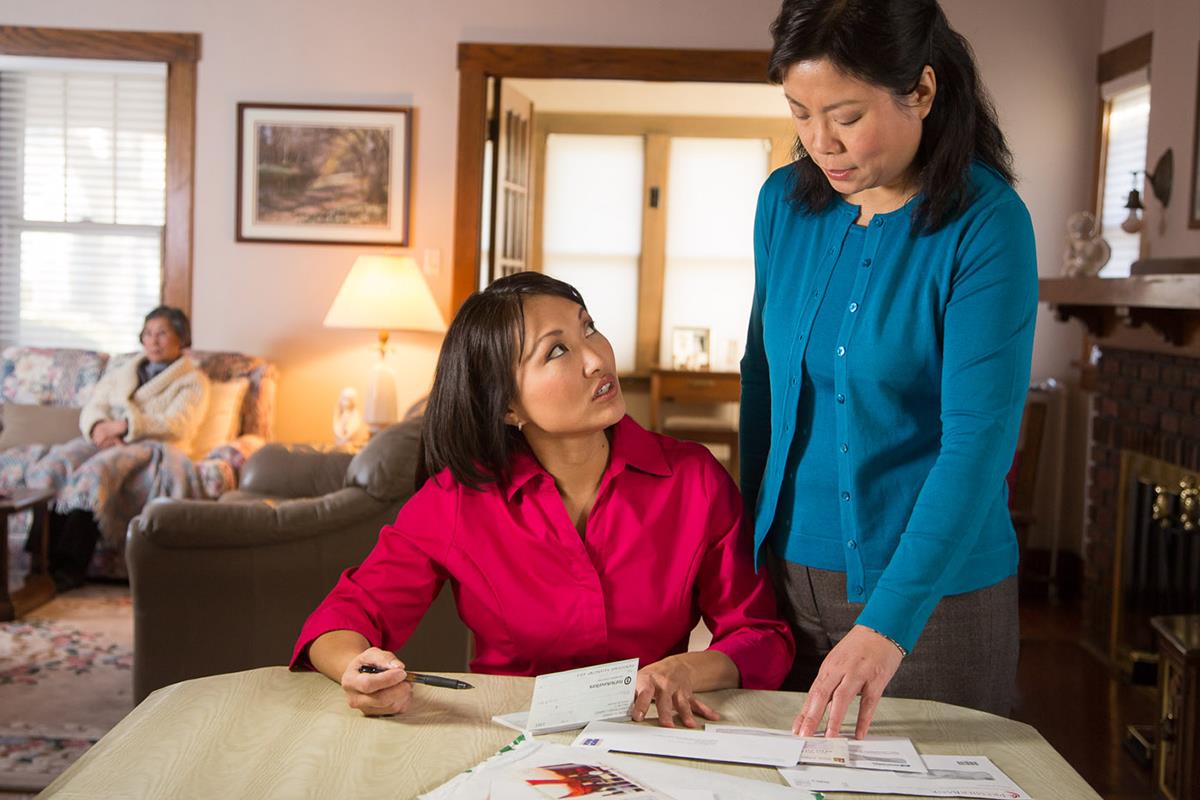 Two Females looking over financial paperwork