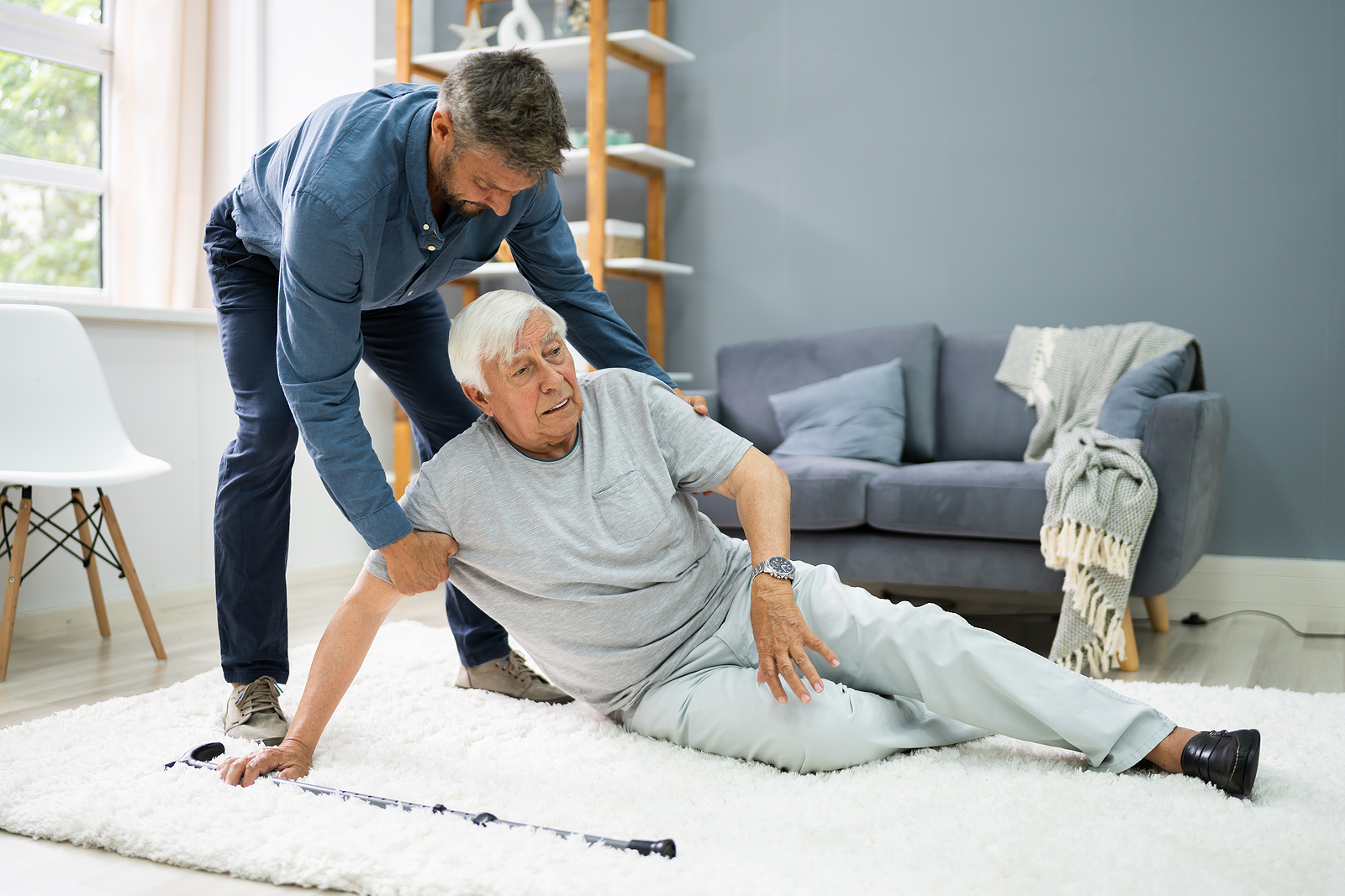 bigstock Helping Elder Senior Fallen Ma 381742700