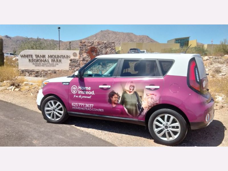 home instead wrapped car with waddell arizona in the background