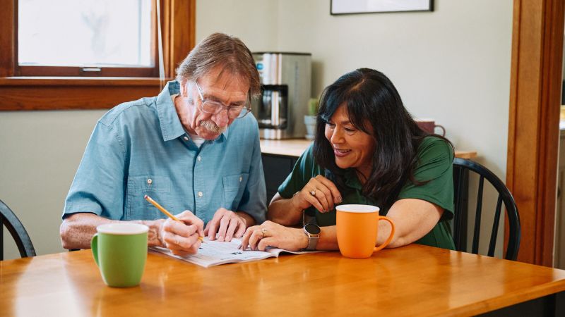 Home Instead caregiver with senior client