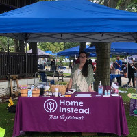 home instead client care coordinator manning booth at stoneham town day 2021