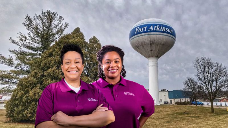 Home Instead caregiver with Fort Atkinson Wisconsin in the background