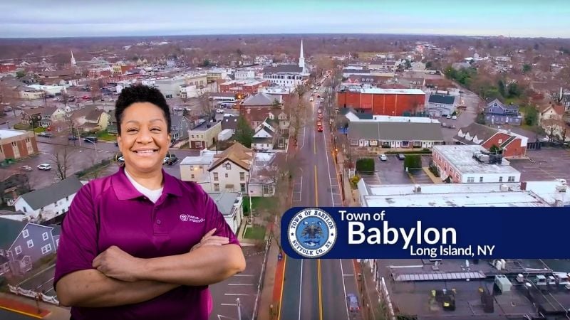 Home Instead caregiver with Babylon Township New York in the background