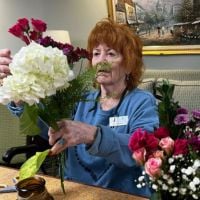 senior making flower arrangement