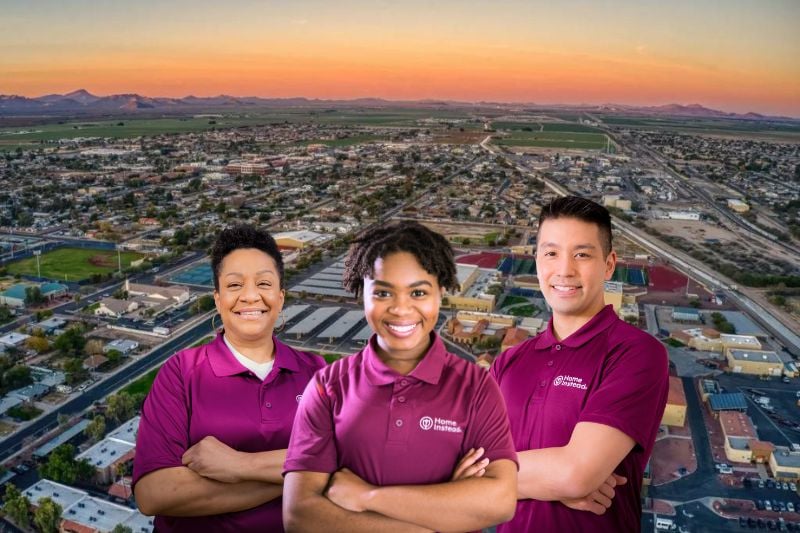 Three Home Instead Caregivers with Buckeye, Arizona in the background