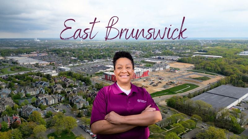 Home Instead caregiver with East Brunswick, New Jersey  in the background