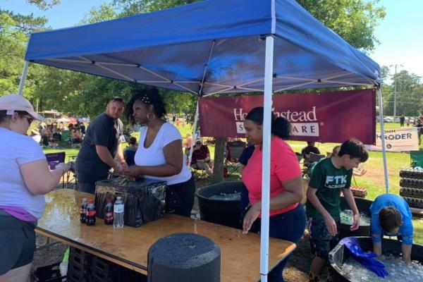 Home Instead of St. Tammany Parish Drink Booth at 16th Annual Hospice House Crawfish Cookoff