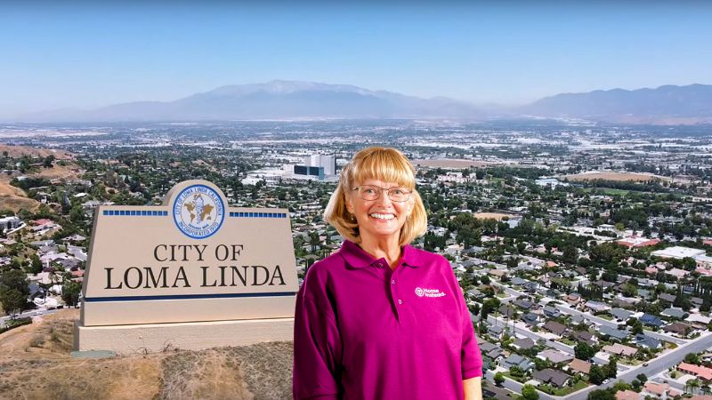 Home Instead caregiver with Loma Linda, California in the background