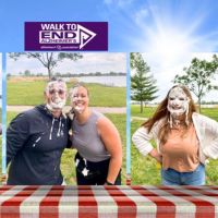 Home Instead of Lincoln team members getting a pie in the face for the alz walk fundraiser