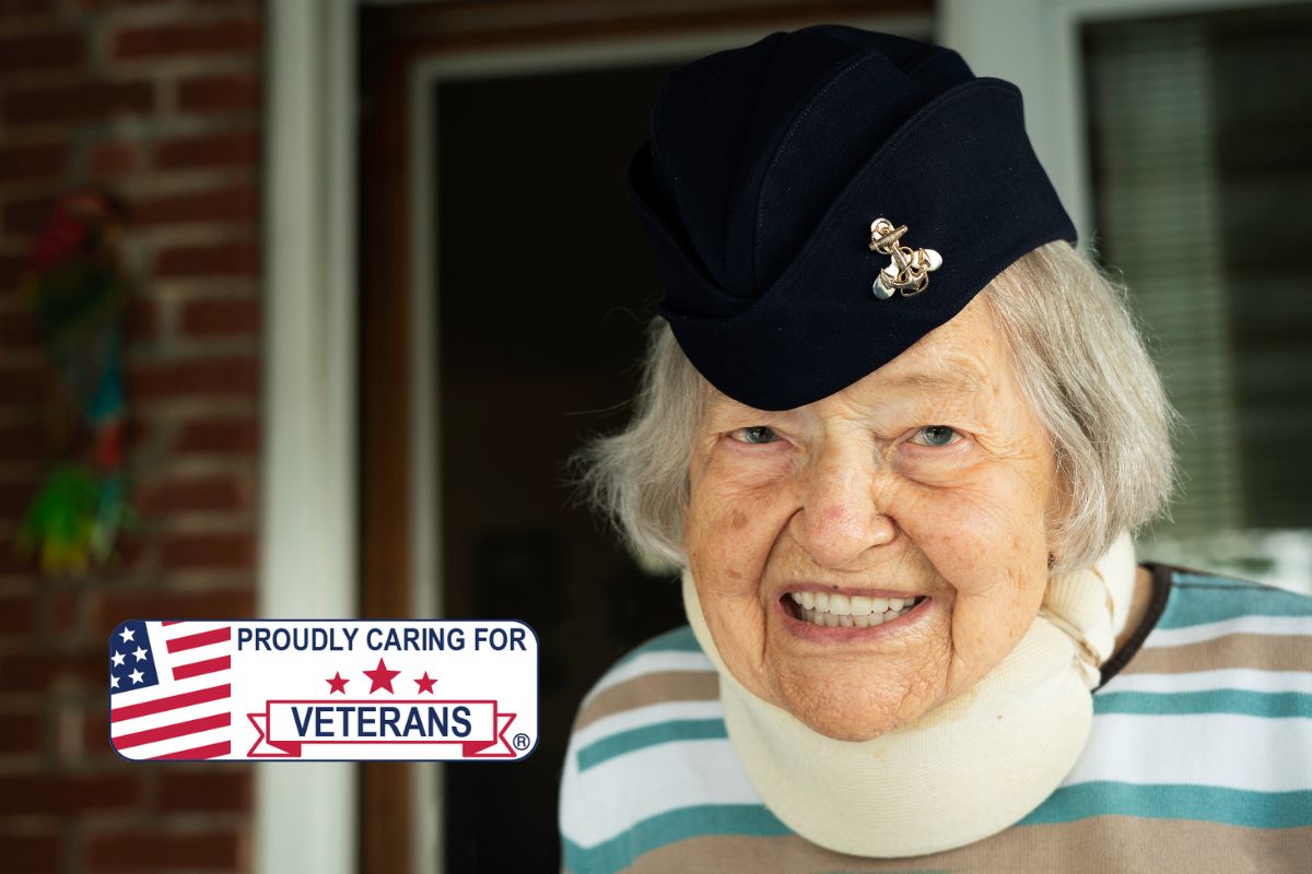 smiling lady veteran proudly sporting her hat