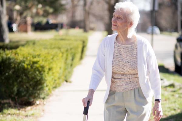 Senior woman taking a walk to reduce stress
