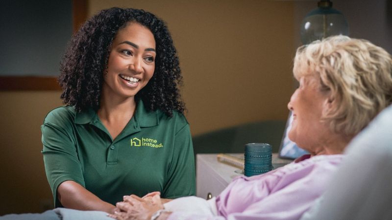 Home Instead caregiver with senior client