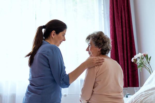 bigstock Home Caregiver Comforting Seni 403250489