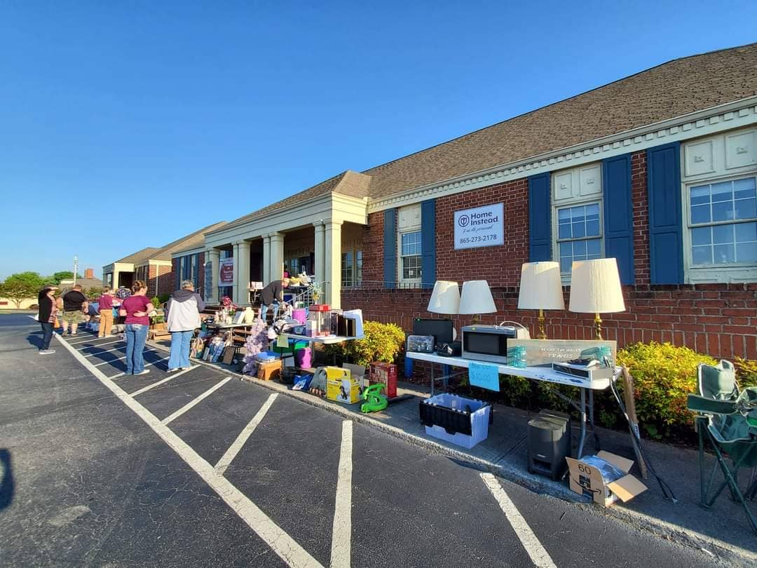 Photo of the sale items tables outside of Home Instead Maryville, TN for the Trash to Treasure Sale and BBQ Fundraiser for Alzheimer’s TN