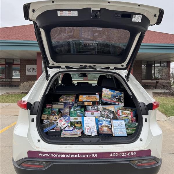 Home Instead Puzzle and Game Donations for Residents at Old Cheney Rehab in Lincoln, NE