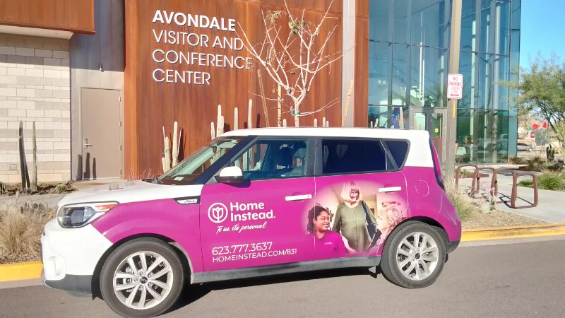 Home Instead of Avondale, AZ wrapped car in front of Avondale Visitor and Conference Center building