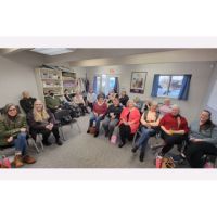 Home Instead Caregivers celebrating at caregivers meeting
