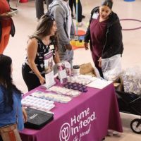 home instead team members at booth at stoneham health and wellness fair