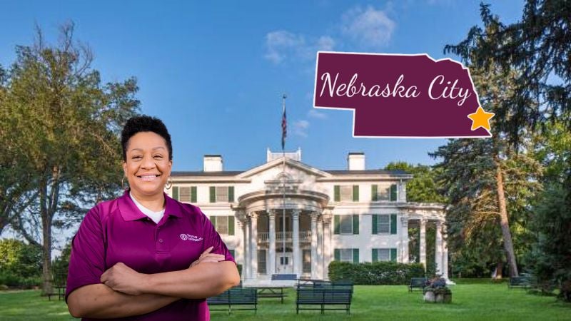 Home Instead caregiver with Nebraska City Nebraska in the background