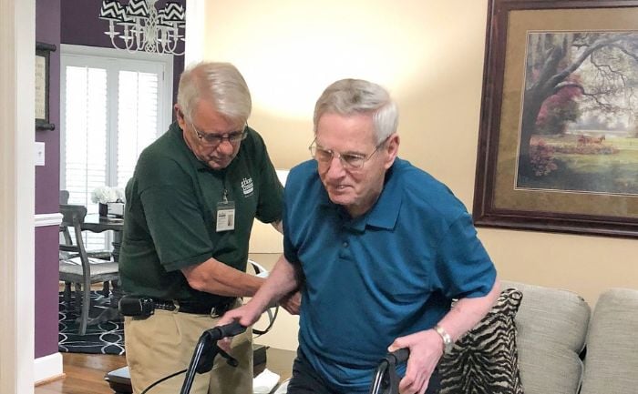 unretired home instead caregiver bob helping a client